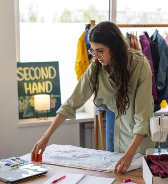 medium-shot-woman-repairing-clothes